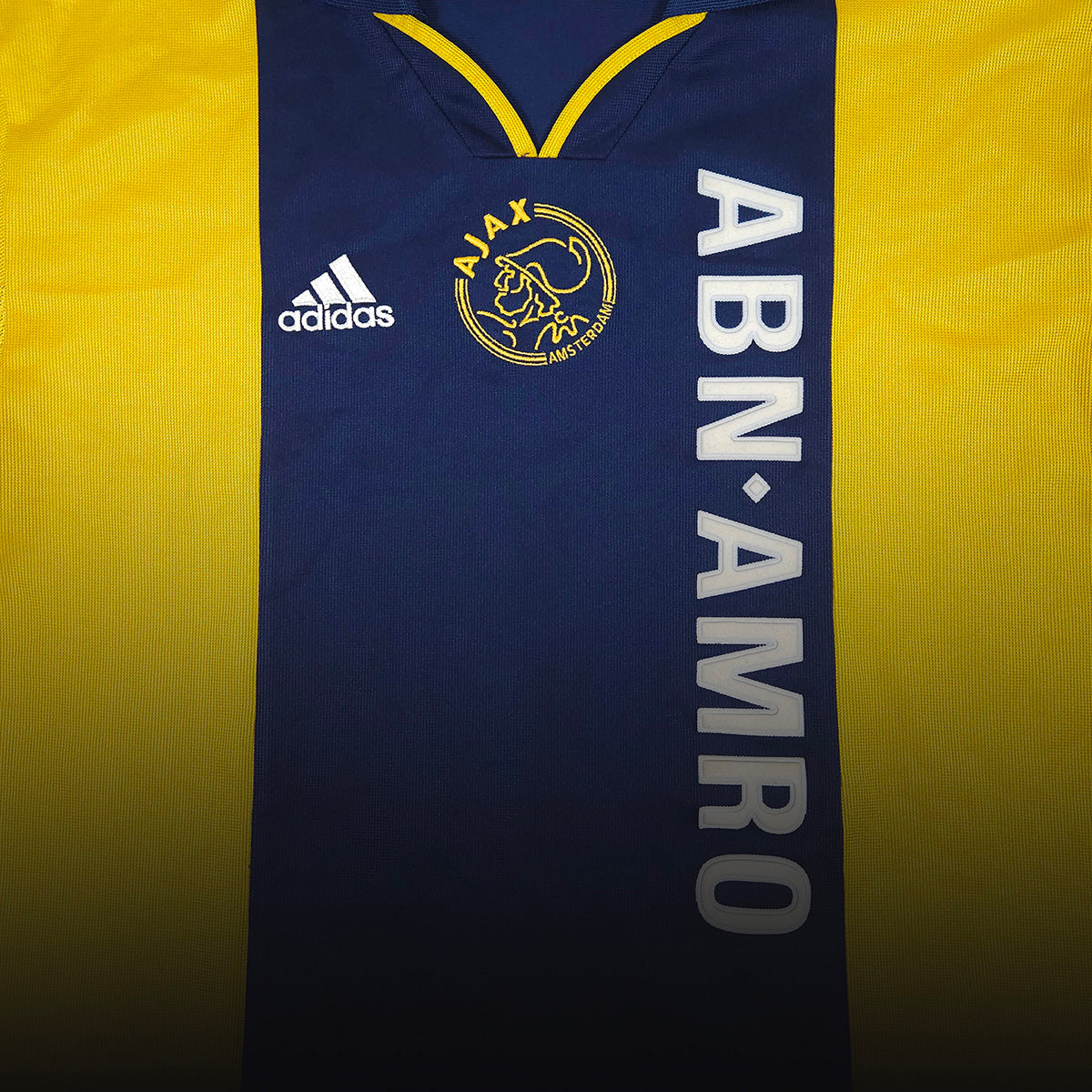 Yellow and dark blue Ajax away football shirt with ABN-AMRO sponsor